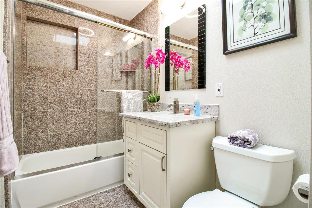 10846 Willowbrook Way Cupertino, CA 95014 - Photo 33 of 48 a bathroom with a sink vanity mirror bathtub and toilet