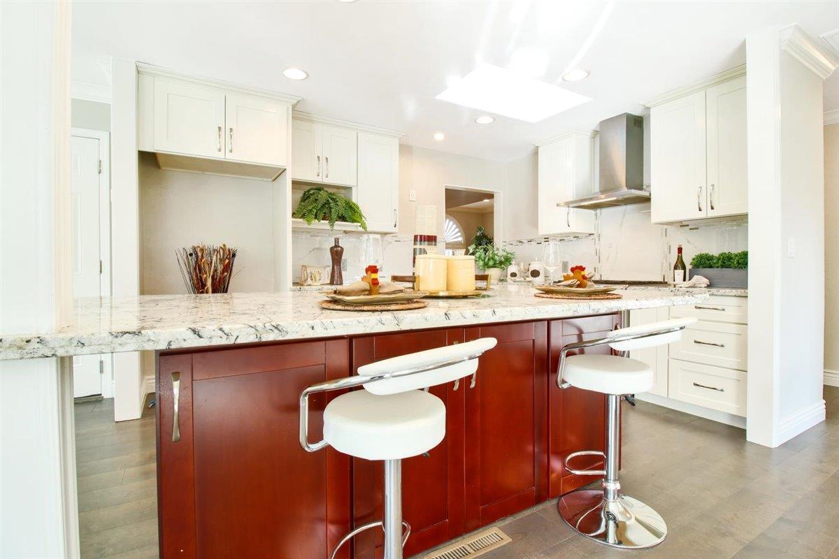 10846 Willowbrook Way Cupertino, CA 95014 - Photo 9 of 48 a kitchen with a sink refrigerator and cabinets