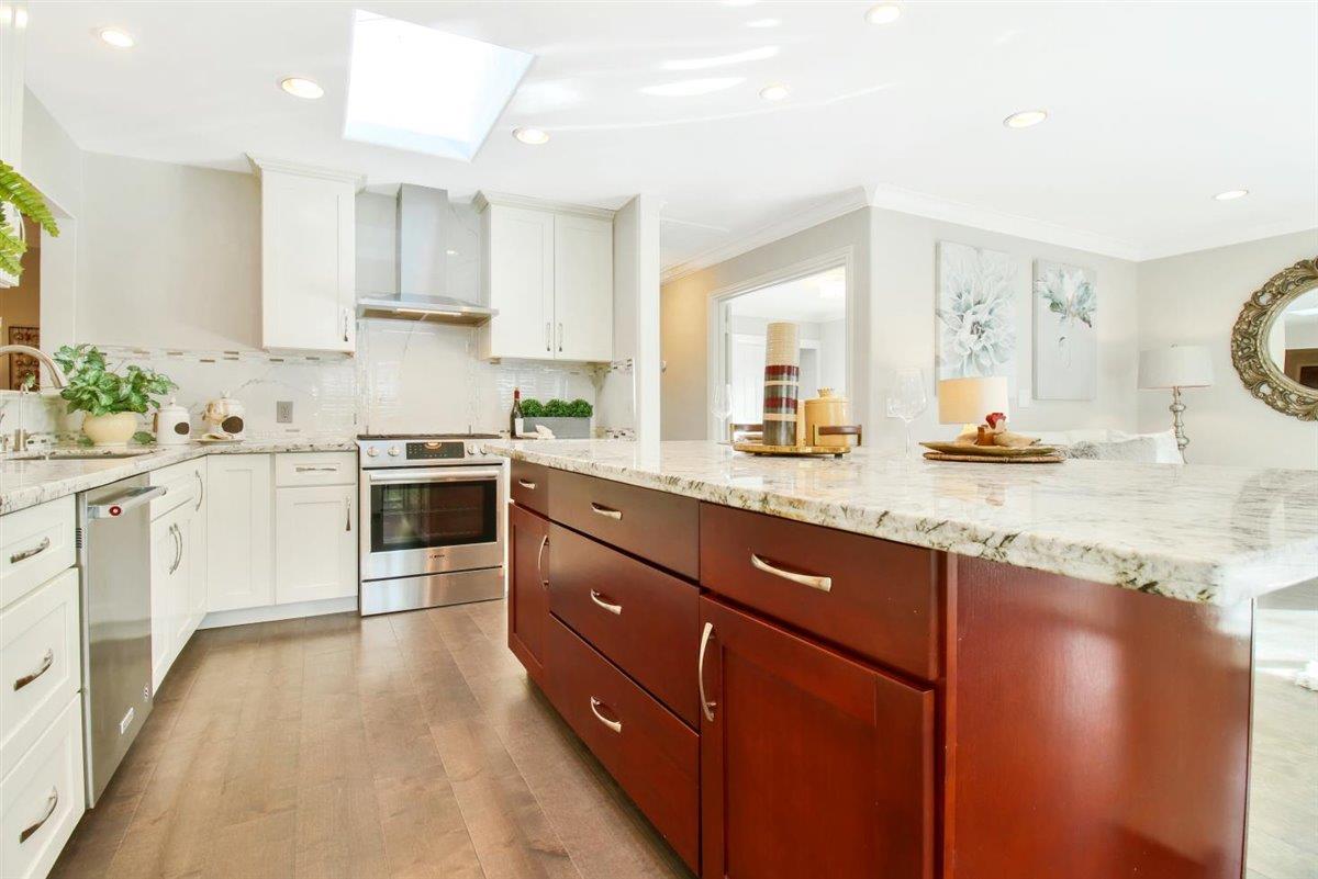 10846 Willowbrook Way Cupertino, CA 95014 - Photo 10 of 48 a kitchen with granite countertop a sink stove and cabinets