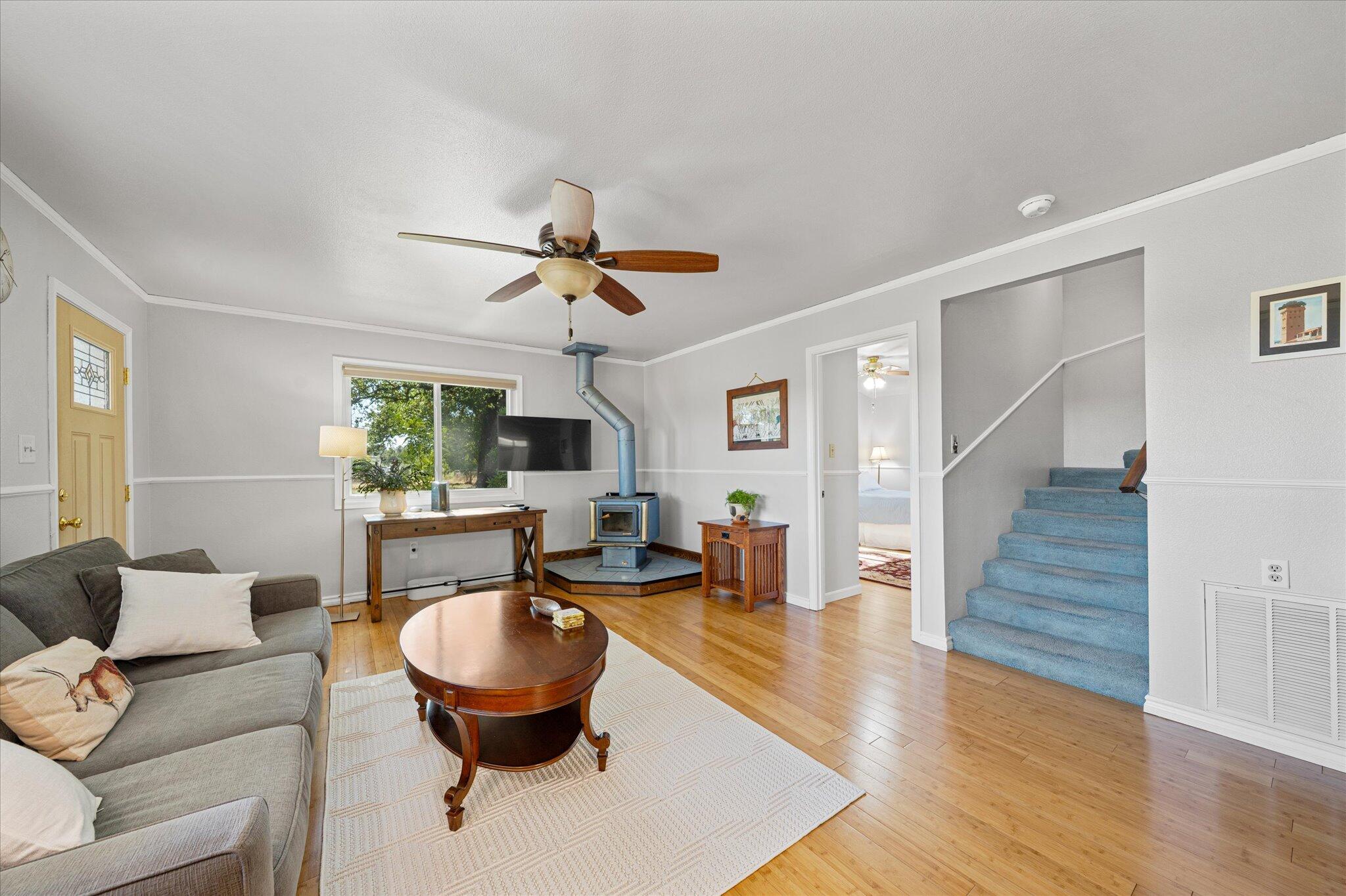 10241 Deschutes Road Palo Cedro, CA 96073 - Photo 11 of 56 a living room with furniture and a wooden floor