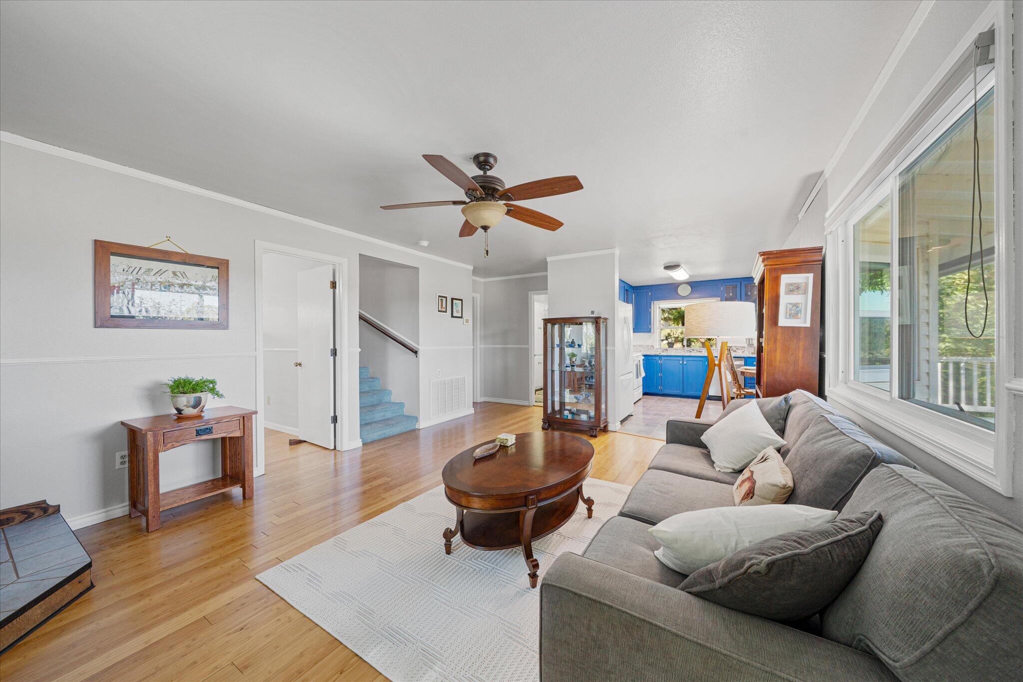 10241 Deschutes Road Palo Cedro, CA 96073 - Photo 12 of 56 a living room with furniture ceiling fan and a large window