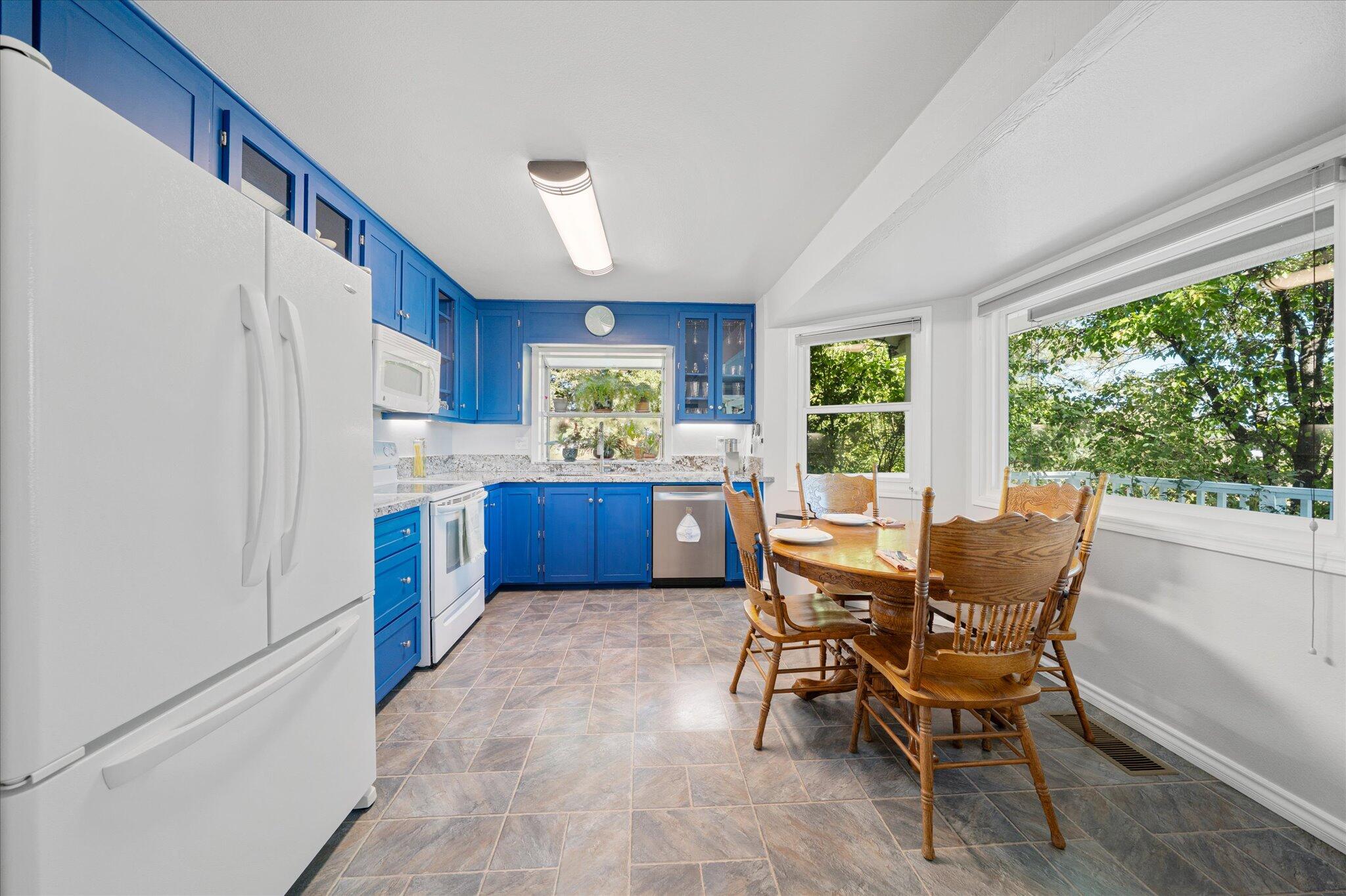 10241 Deschutes Road Palo Cedro, CA 96073 - Photo 14 of 56 a view of a dining room with furniture window and outside view