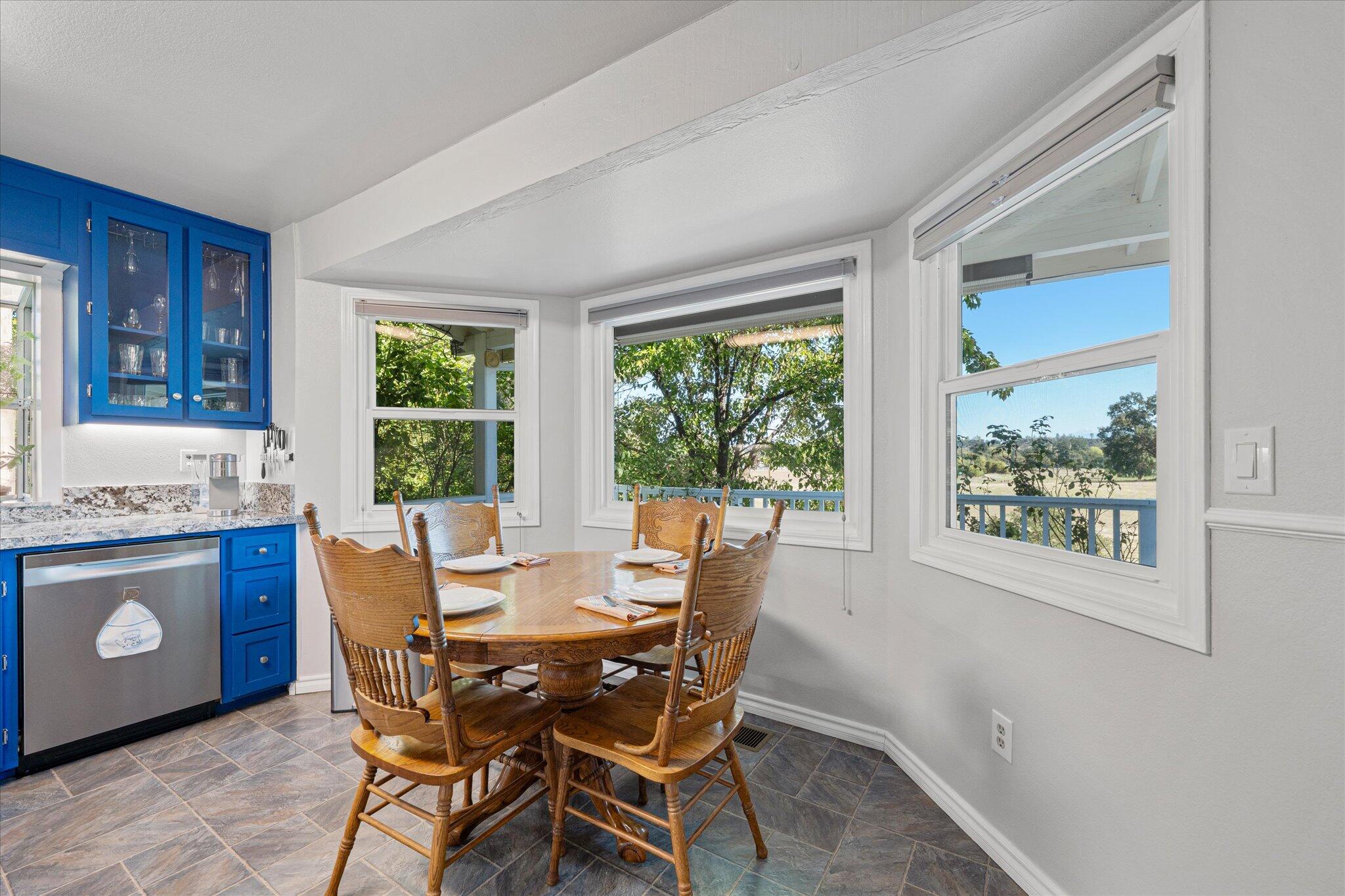 10241 Deschutes Road Palo Cedro, CA 96073 - Photo 15 of 56 a view of a dining room with furniture window and outside view
