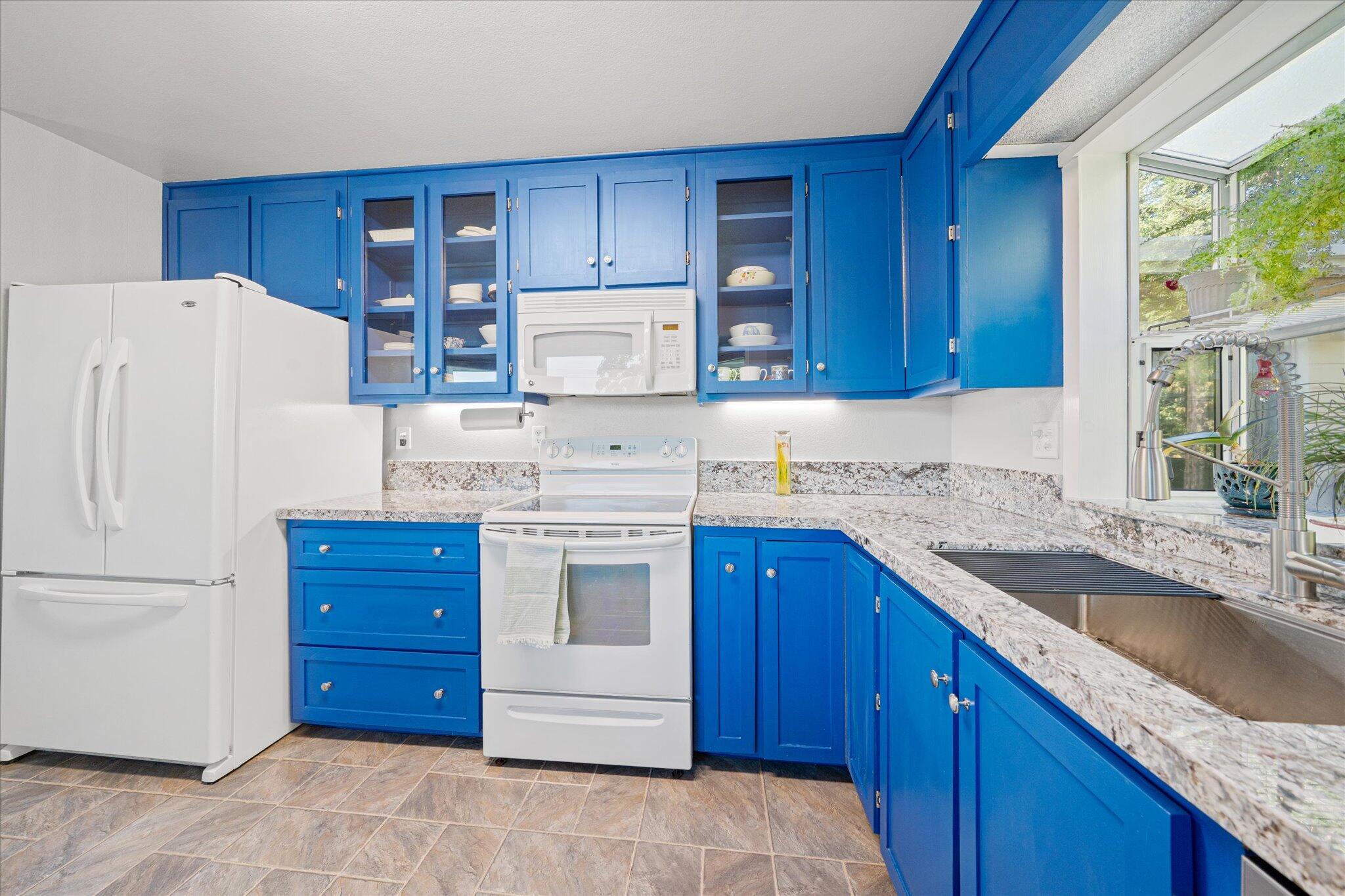10241 Deschutes Road Palo Cedro, CA 96073 - Photo 16 of 56 a kitchen with stainless steel appliances granite countertop a refrigerator stove a sink and dishwasher