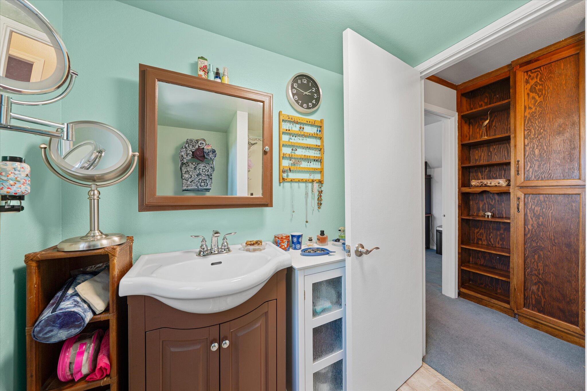 10241 Deschutes Road Palo Cedro, CA 96073 - Photo 26 of 56 a bathroom with a sink and a mirror