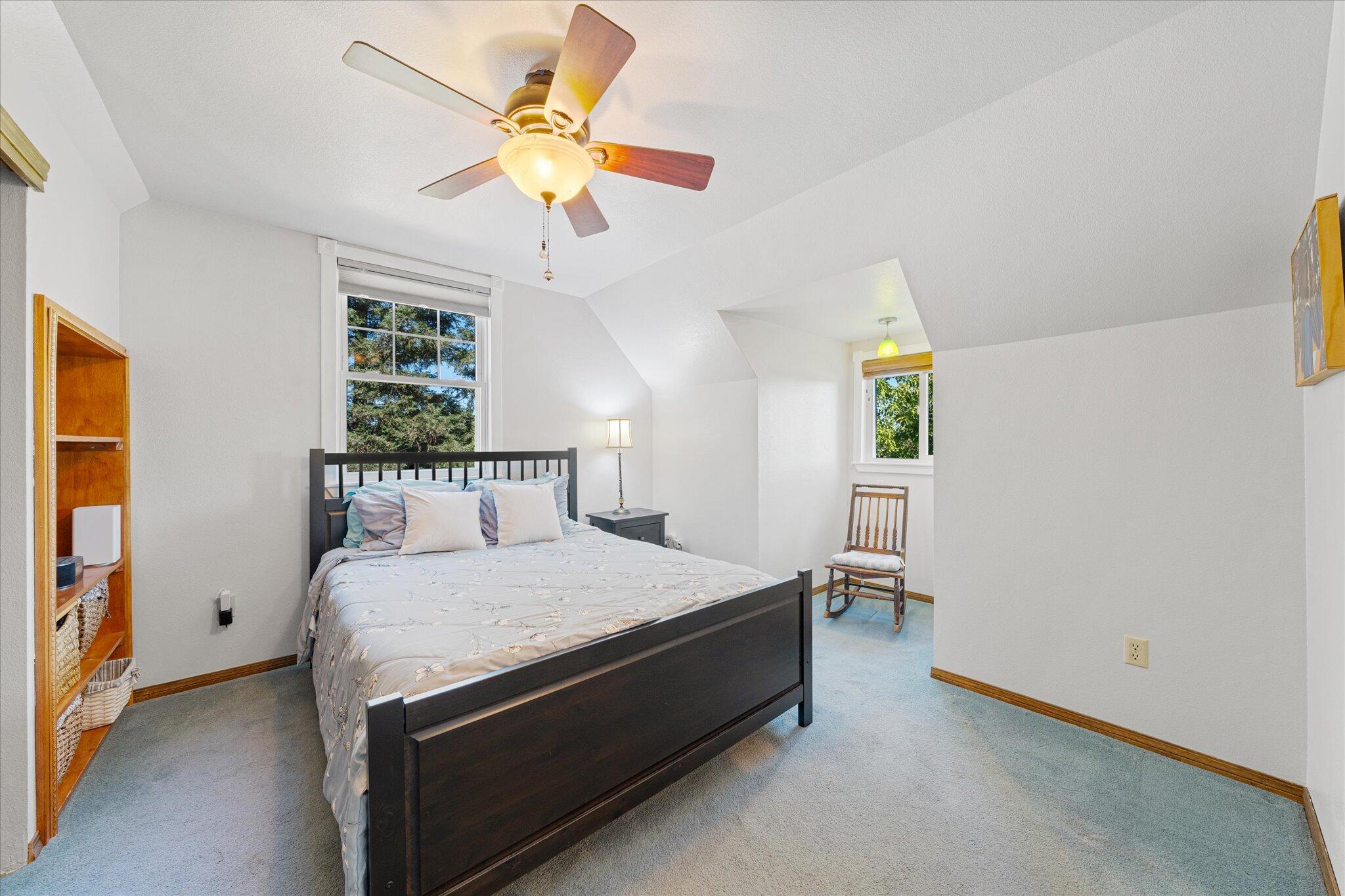 10241 Deschutes Road Palo Cedro, CA 96073 - Photo 28 of 56 a bedroom with a bed and a table