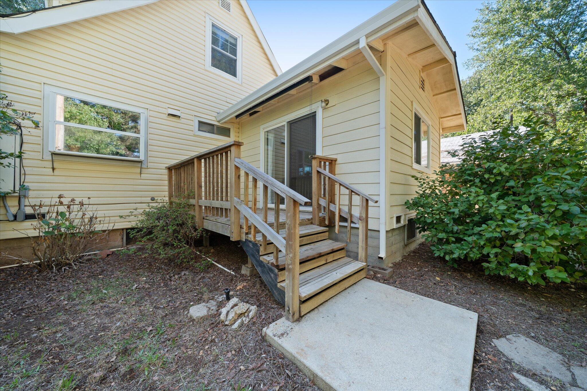 10241 Deschutes Road Palo Cedro, CA 96073 - Photo 38 of 56 a view of a house with backyard and sitting area