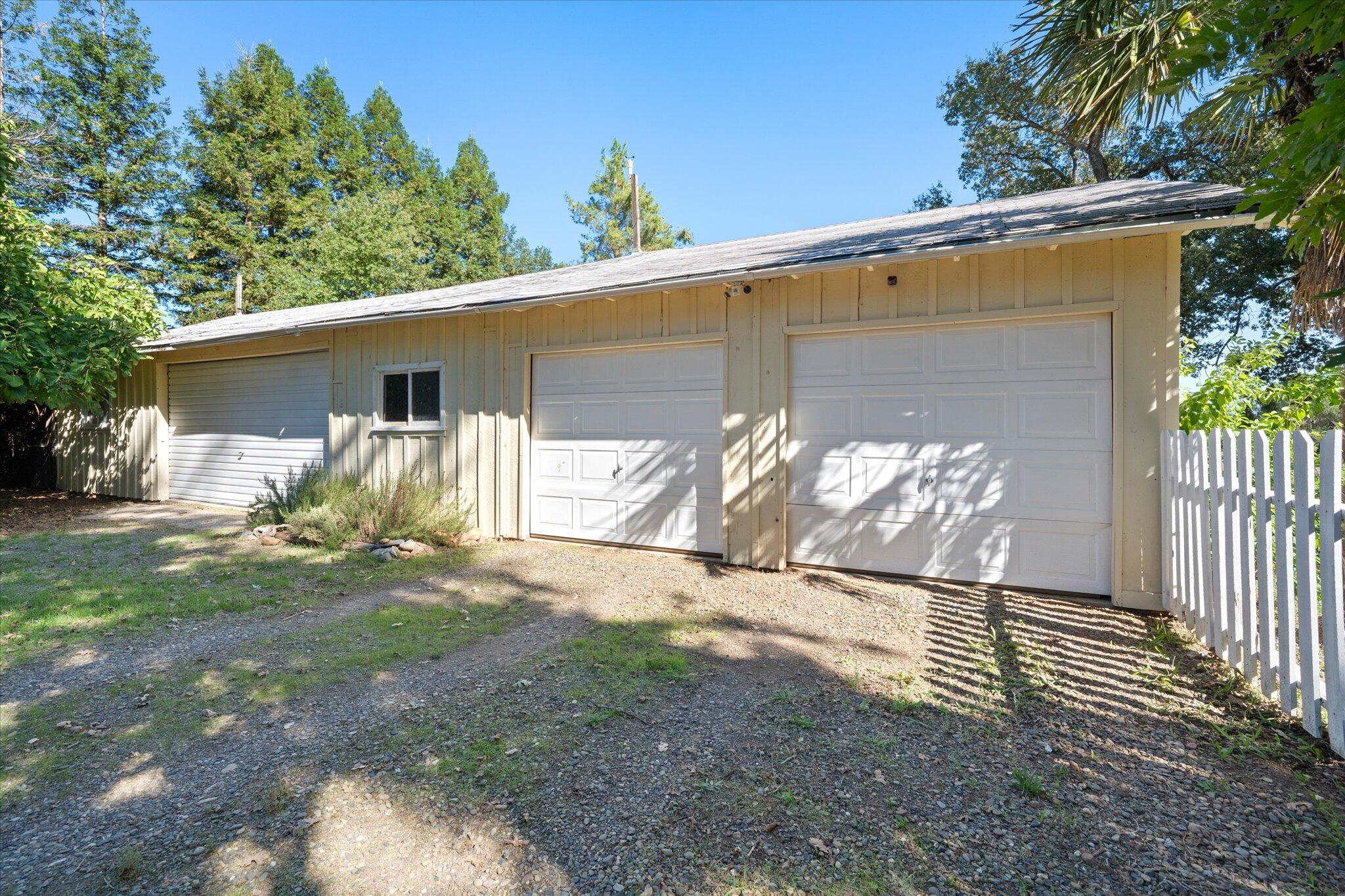10241 Deschutes Road Palo Cedro, CA 96073 - Photo 40 of 56 a view of a yard with a house and a yard