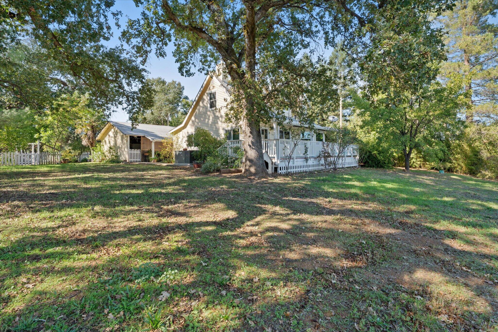10241 Deschutes Road Palo Cedro, CA 96073 - Photo 43 of 56 a view of a house with a yard