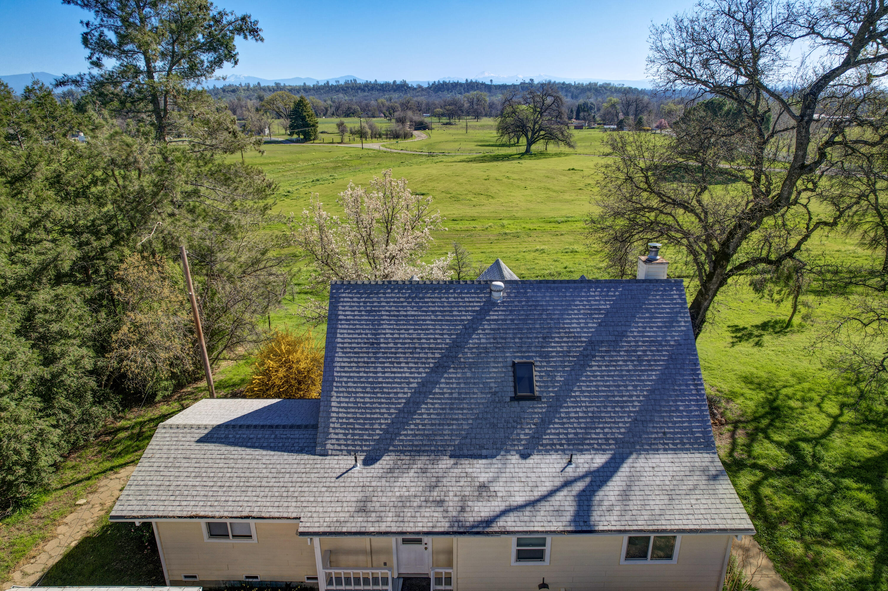 10241 Deschutes Road Palo Cedro, CA 96073 - Photo 54 of 56 an aerial view of a house with a yard lake view and mountain view