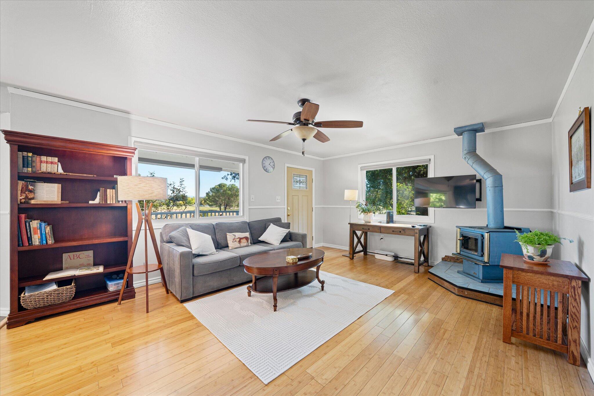 10241 Deschutes Road Palo Cedro, CA 96073 - Photo 9 of 56 a living room with furniture and a wooden floor