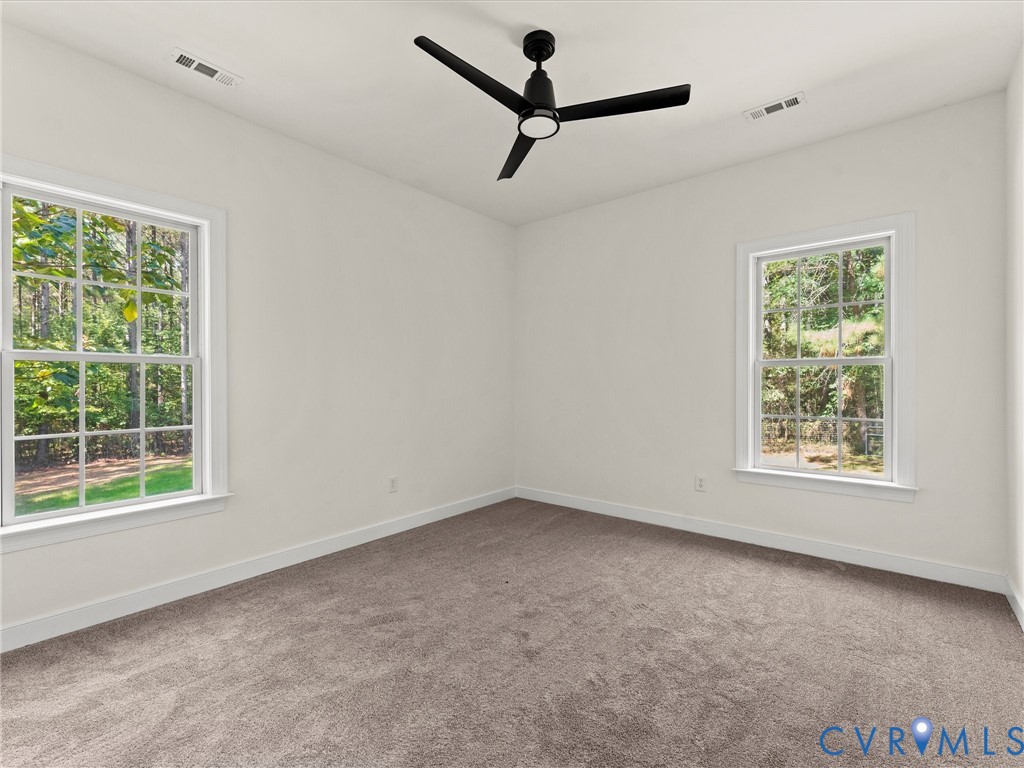 12 Henderson Road New Canton, VA 23123 - Photo 23 of 49 Light-filled interior featuring two multi-pane win