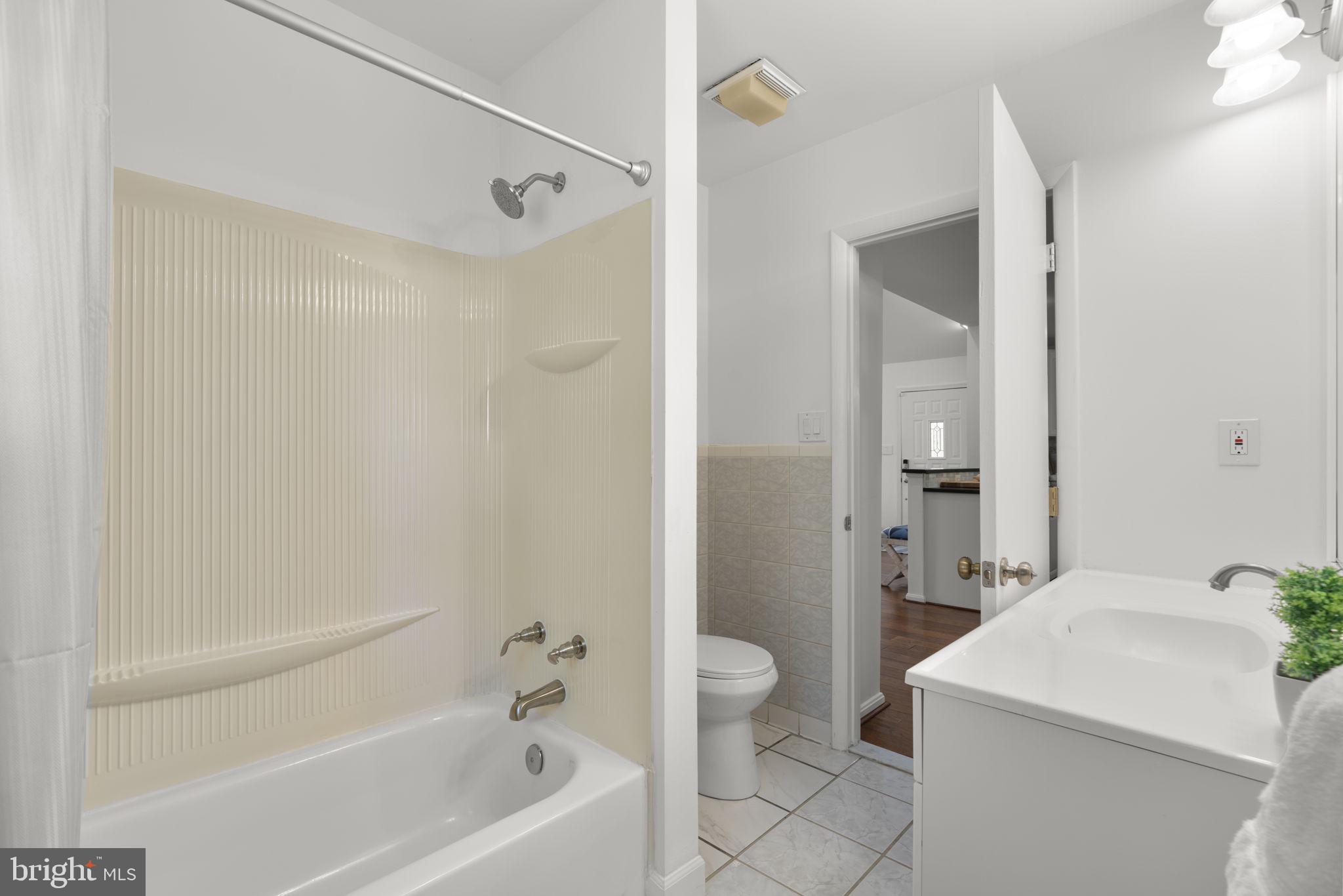 25 Leeland Road Edgewater, MD 21037 - Photo 23 of 48 a bathroom with a sink a toilet and shower