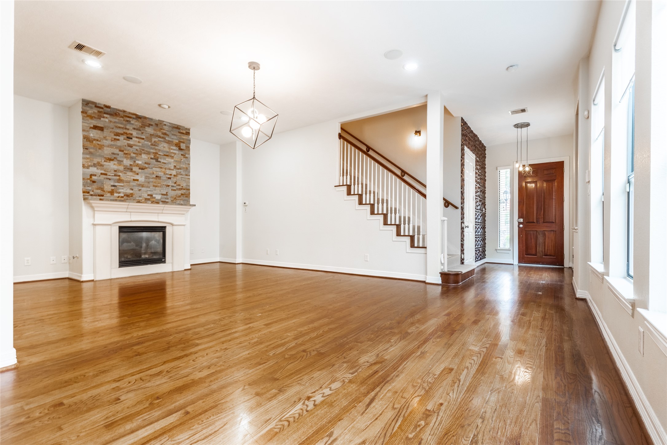 2923 Royal Oaks Crest Houston, TX 77082 - Photo 8 of 31 a view of an empty room with wooden floor fireplace and a window