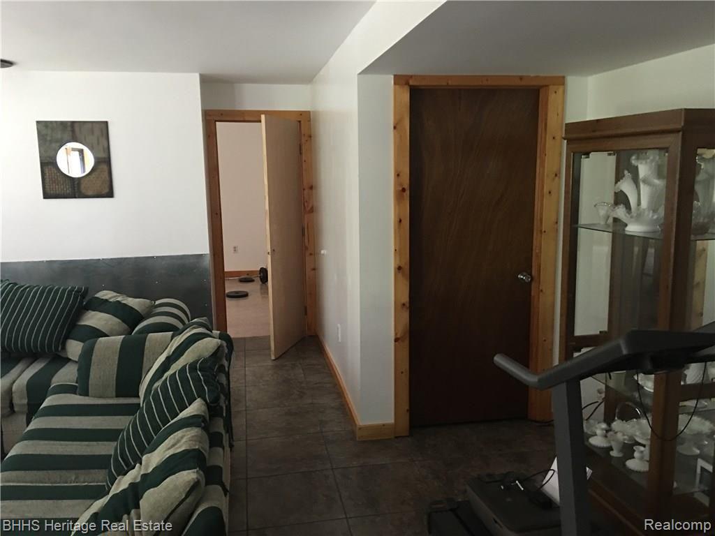 4535 West Allen Road Howell, MI 48855 - Photo 25 of 34 Lower level with 4th bedroom and lots of storage