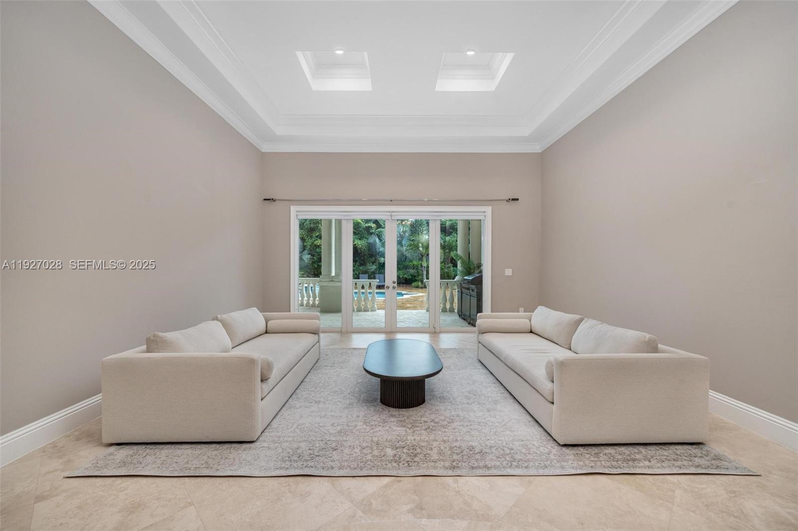 6890 Southwest 94th Street Pinecrest, FL 33156 - Photo 24 of 94 a living room with couches and a dining table with garden view