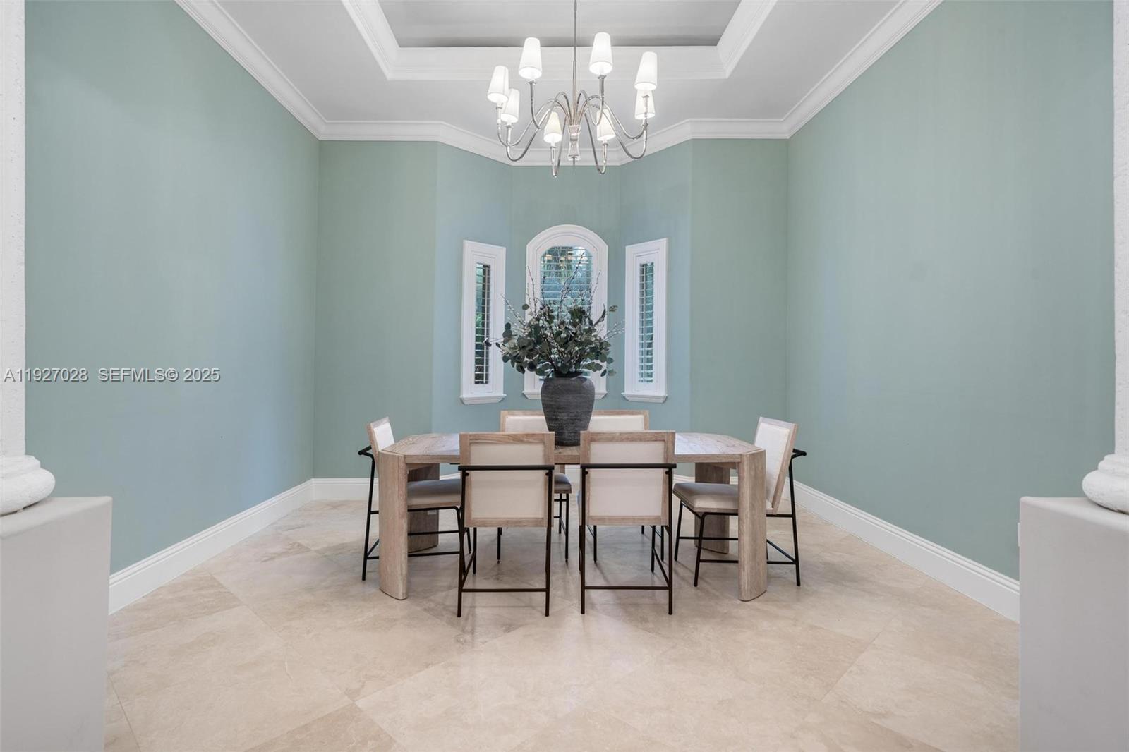 6890 Southwest 94th Street Pinecrest, FL 33156 - Photo 26 of 94 a view of a dining room with furniture and chandelier