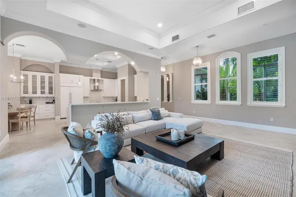 a spacious bedroom with a bed a table and chair