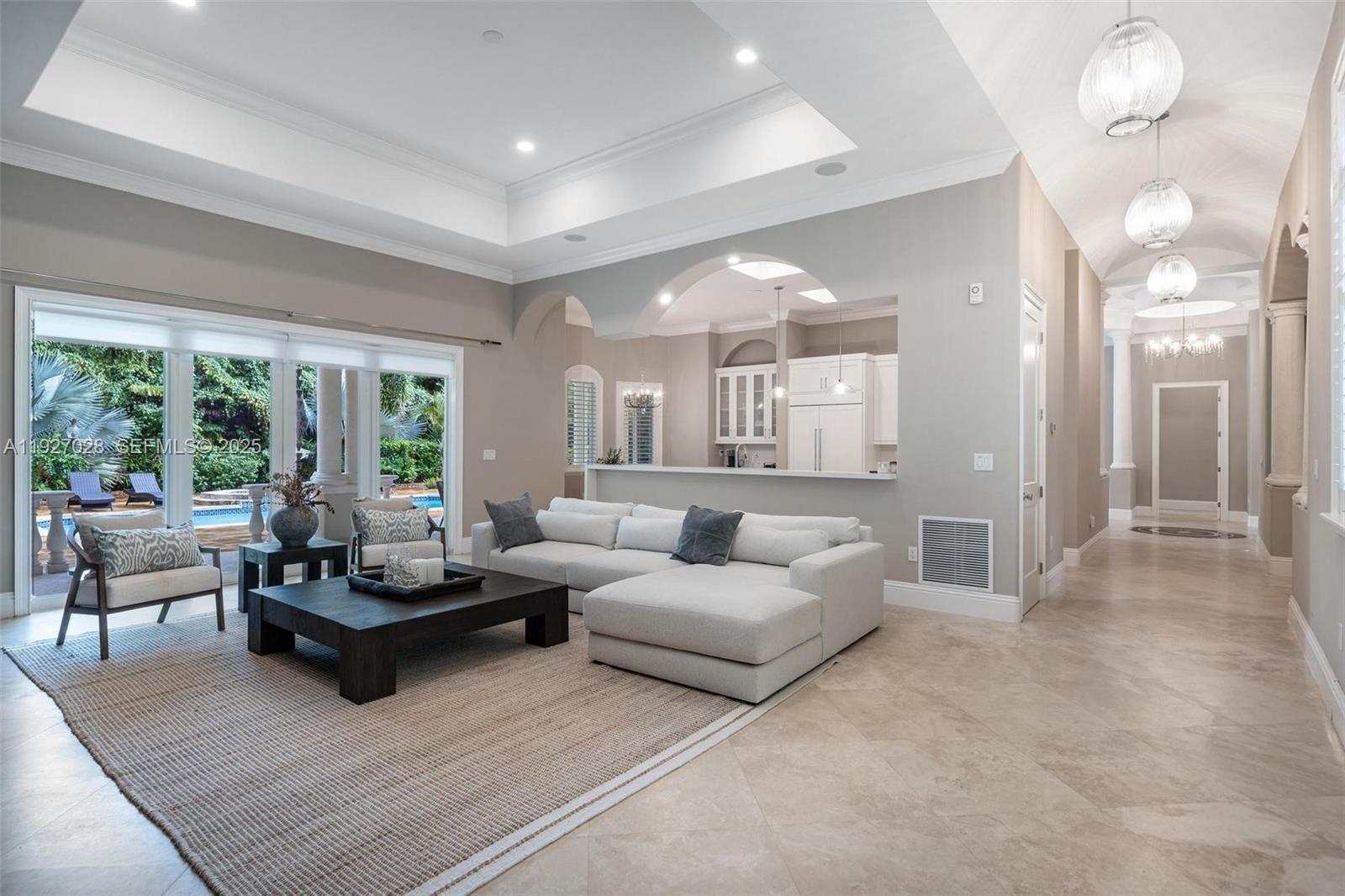 6890 Southwest 94th Street Pinecrest, FL 33156 - Photo 30 of 94 a living room with furniture and a large window