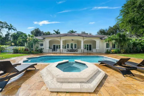 a spacious bathroom with a double vanity sink and a mirror