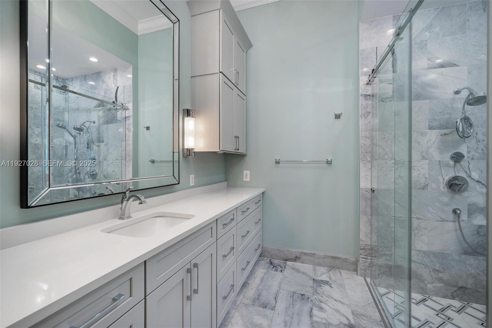 6890 Southwest 94th Street Pinecrest, FL 33156 - Photo 51 of 94 a bathroom with a shower sink and mirror