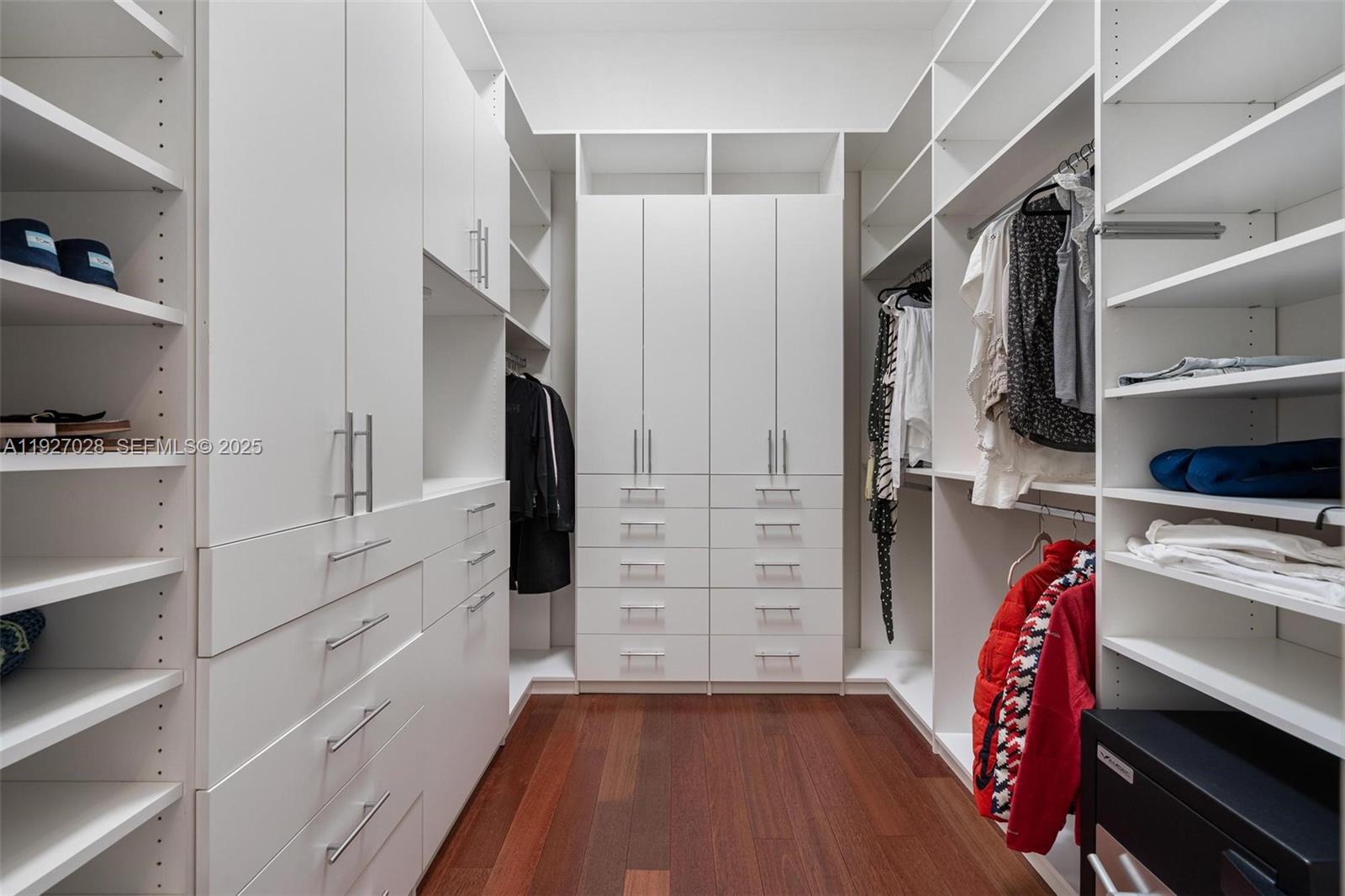 6890 Southwest 94th Street Pinecrest, FL 33156 - Photo 54 of 94 a view of walk in closet with clothes and shoes