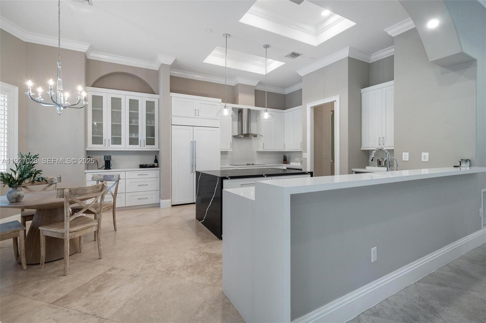 6890 Southwest 94th Street Pinecrest, FL 33156 - Photo 6 of 94 a kitchen with kitchen island granite countertop a sink cabinets and stainless steel appliances