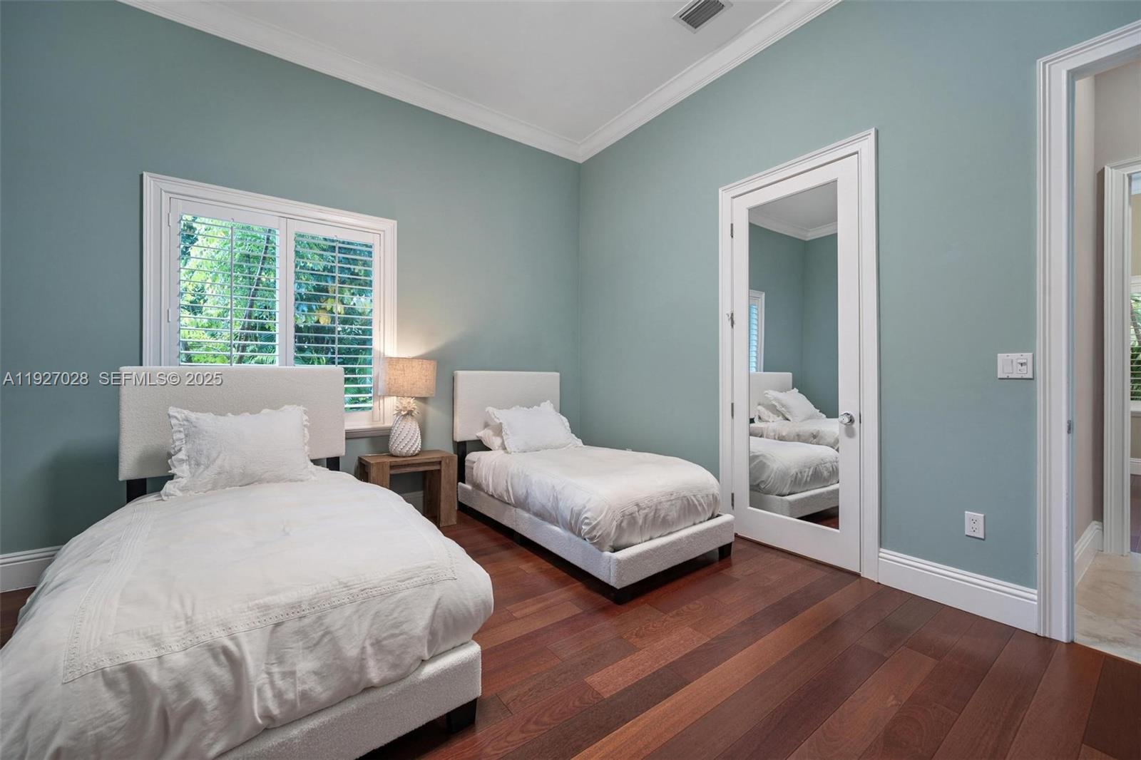 6890 Southwest 94th Street Pinecrest, FL 33156 - Photo 63 of 94 a bedroom with two beds and a potted plant