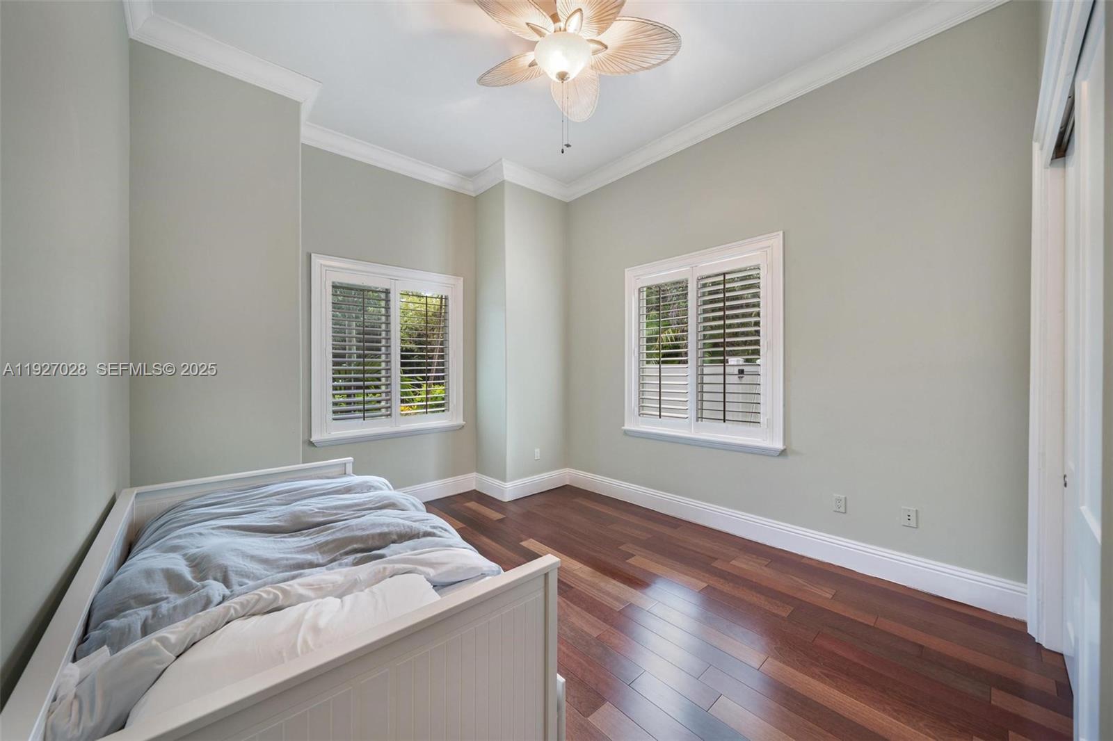 6890 Southwest 94th Street Pinecrest, FL 33156 - Photo 66 of 94 a bedroom with a bed and a window