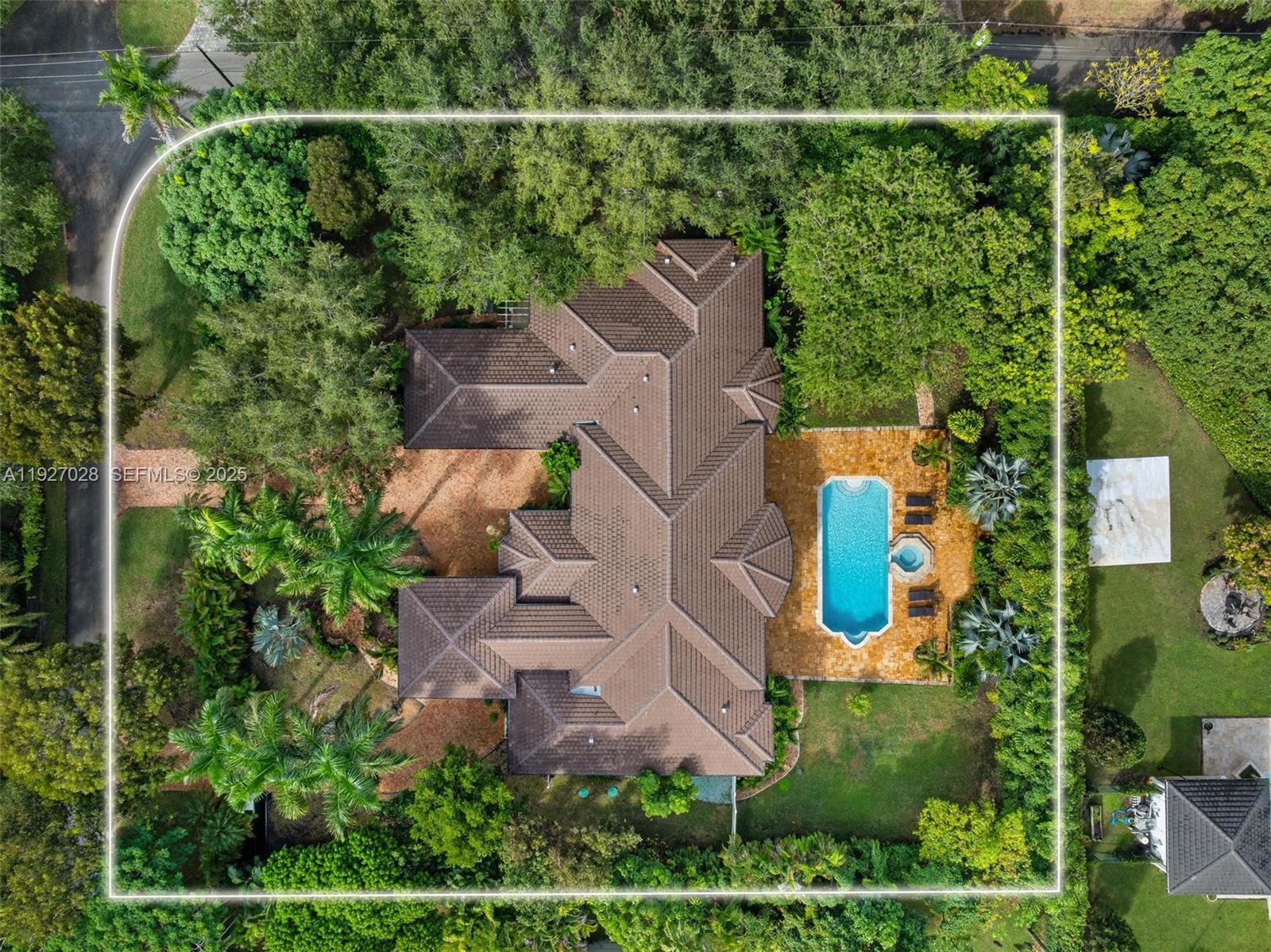 6890 Southwest 94th Street Pinecrest, FL 33156 - Photo 77 of 94 an aerial view of a house with a yard