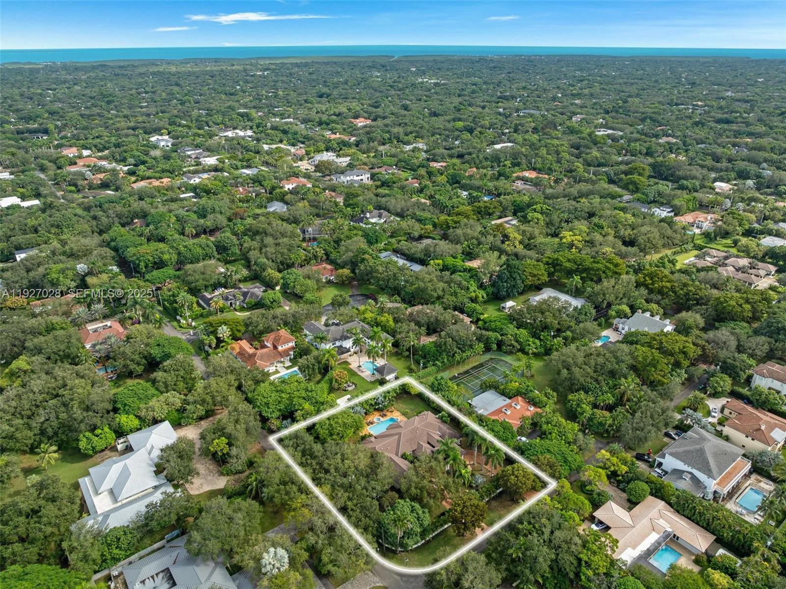 6890 Southwest 94th Street Pinecrest, FL 33156 - Photo 81 of 94 an aerial view of residential houses with outdoor space and trees