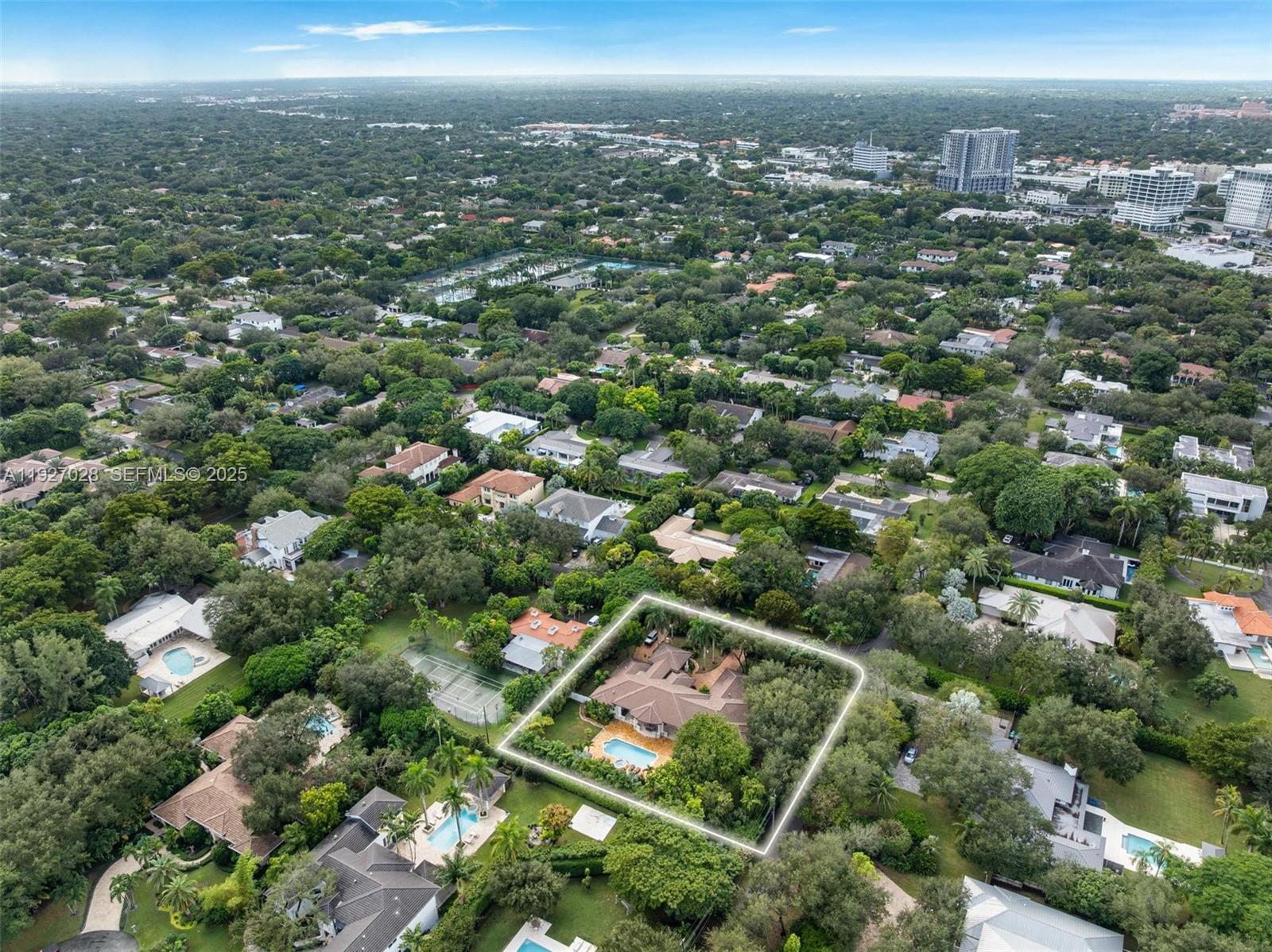 6890 Southwest 94th Street Pinecrest, FL 33156 - Photo 91 of 94 an aerial view of residential houses with outdoor space and trees