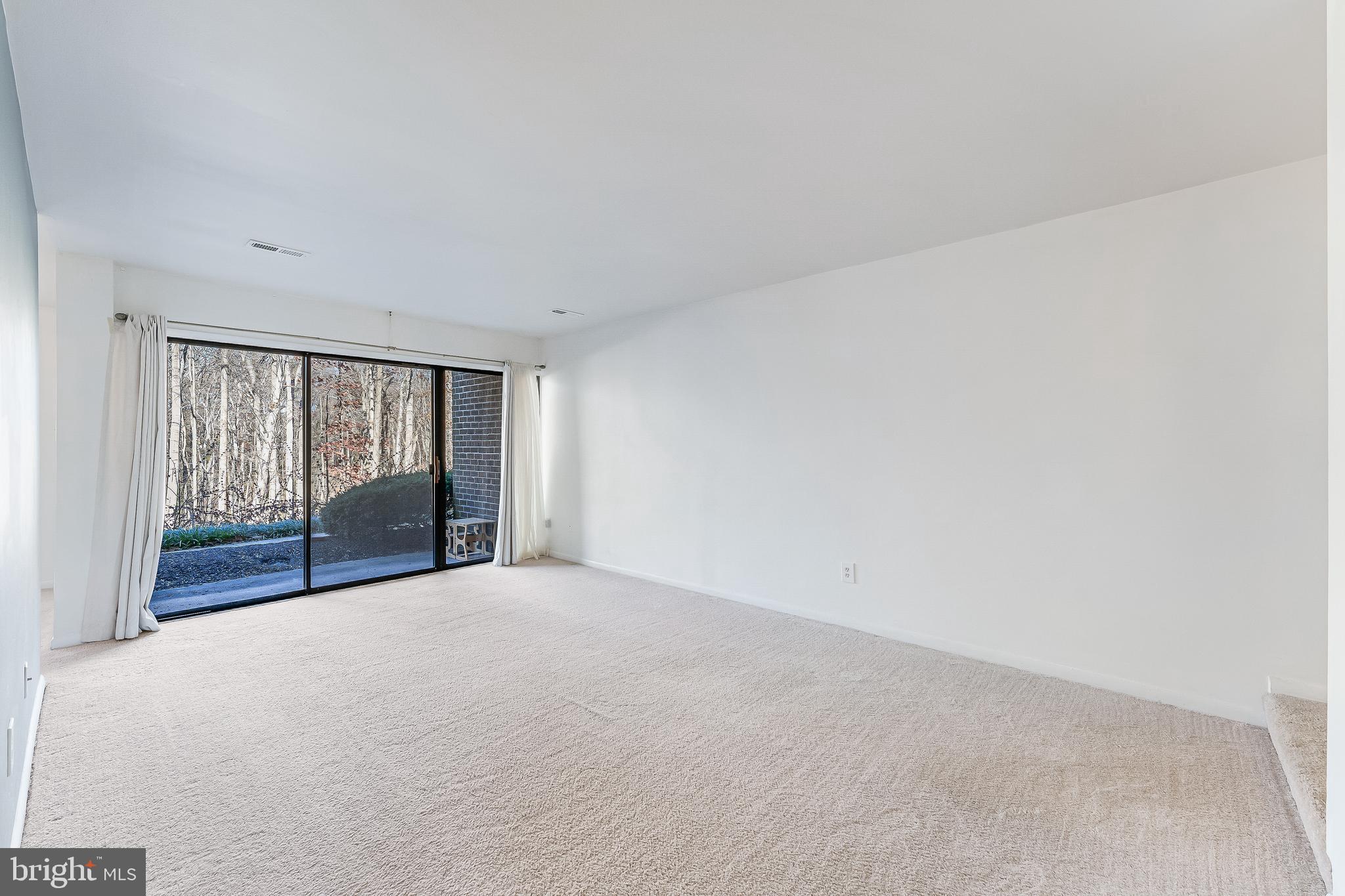 11240 Chestnut Grove Square, Unit 31 Reston, VA 20190 - Photo 15 of 34 a view of an empty room with a window