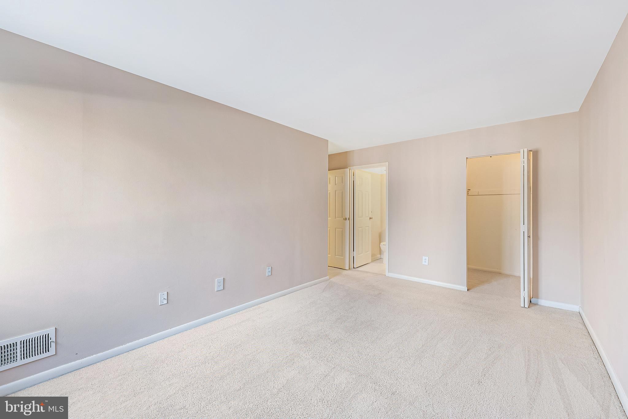 11240 Chestnut Grove Square, Unit 31 Reston, VA 20190 - Photo 17 of 34 a view of an empty room and a window