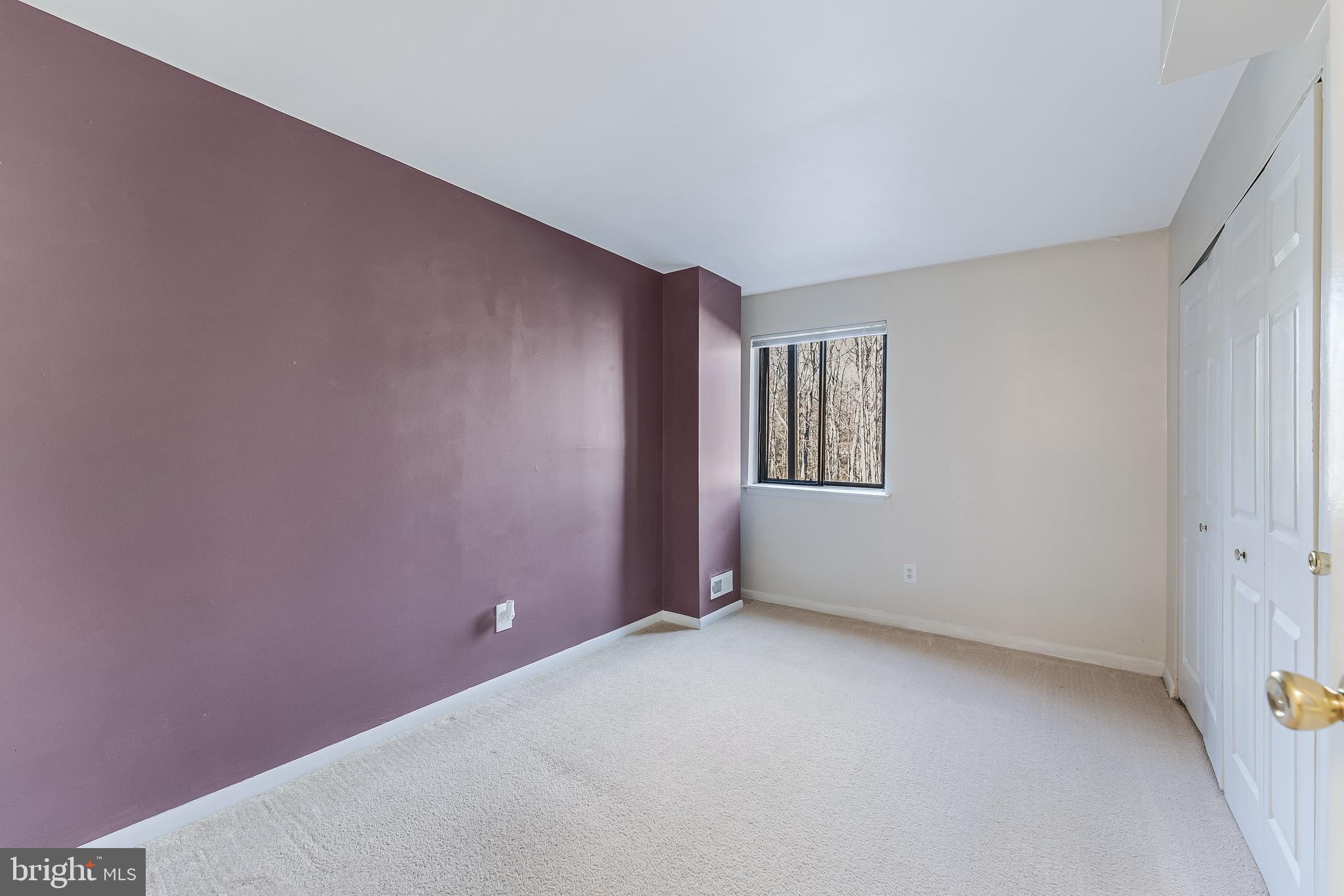 11240 Chestnut Grove Square, Unit 31 Reston, VA 20190 - Photo 22 of 34 a view of an empty room with windows