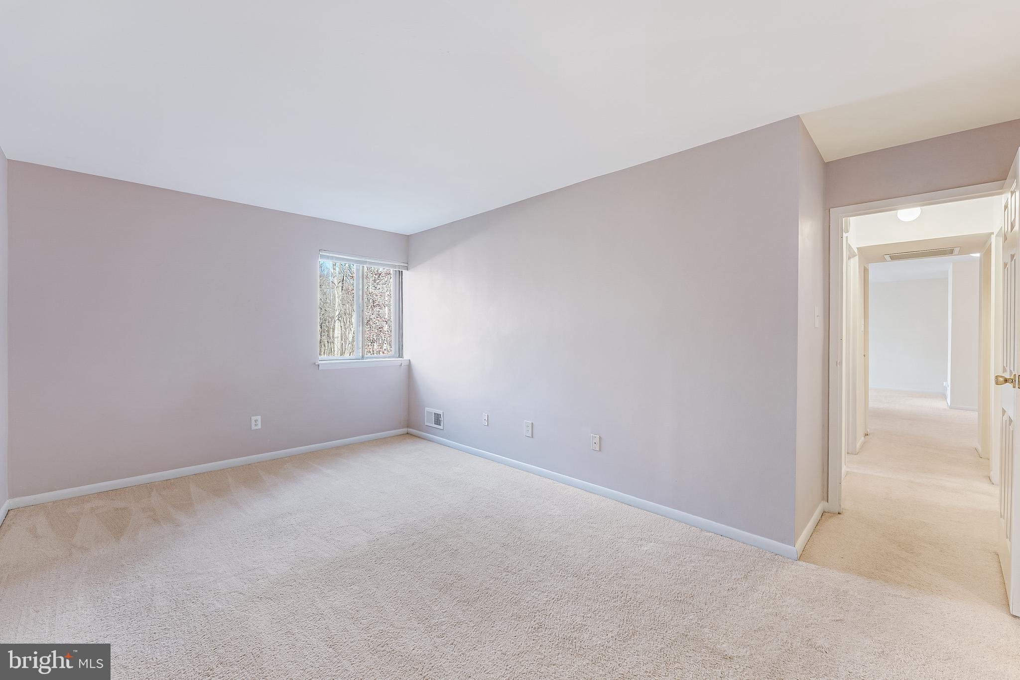 11240 Chestnut Grove Square, Unit 31 Reston, VA 20190 - Photo 26 of 34 an empty room with windows