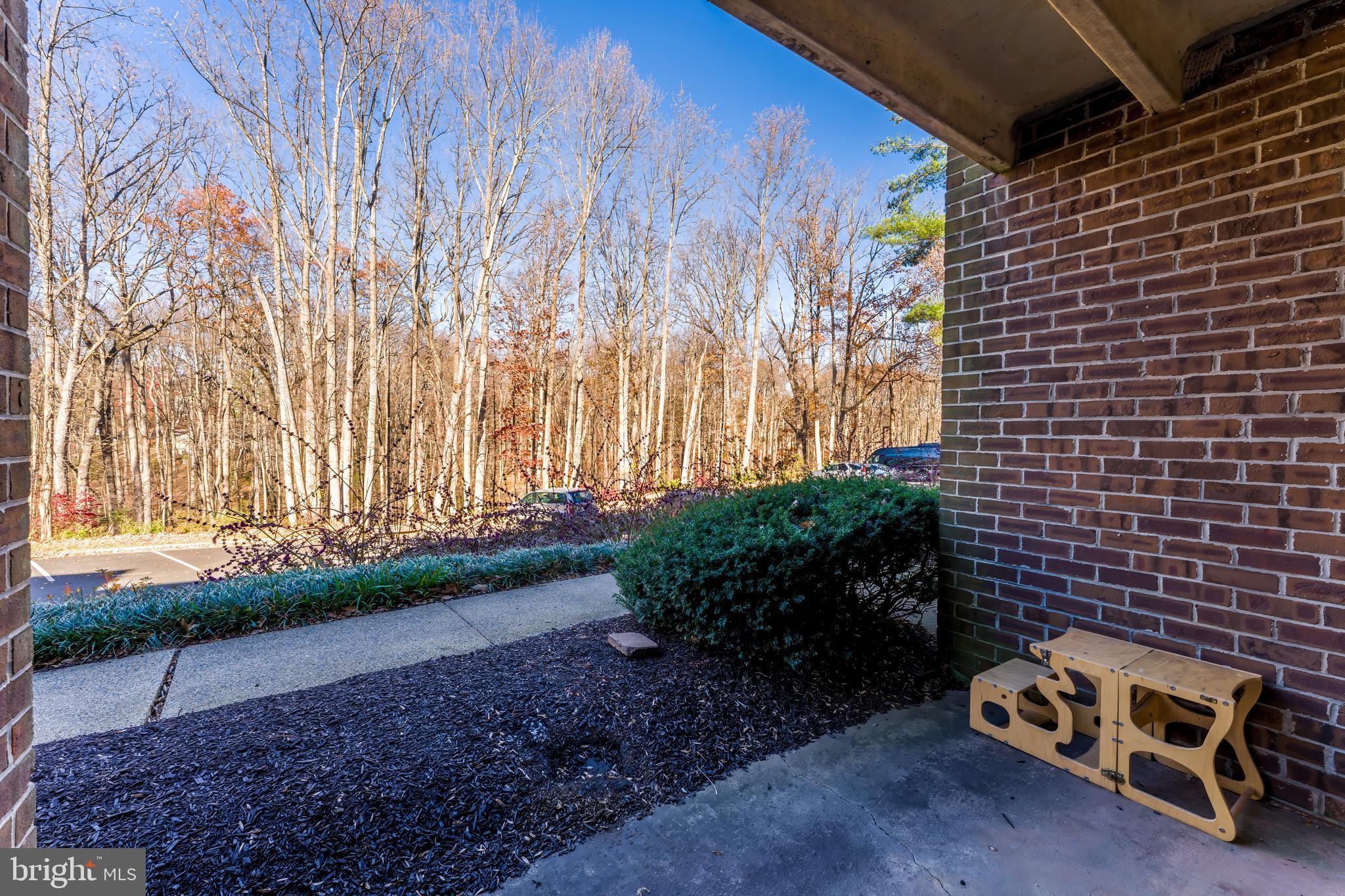 11240 Chestnut Grove Square, Unit 31 Reston, VA 20190 - Photo 29 of 34 a view of a street with a garage