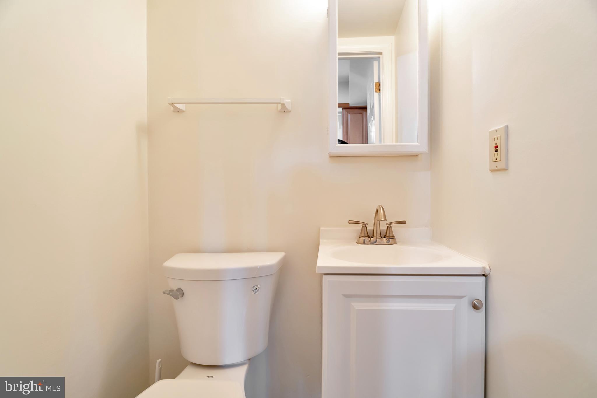 431 Eagle Road, Unit 16 Wayne, PA 19087 - Photo 34 of 48 a bathroom with a toilet sink and mirror