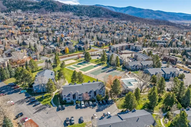 an aerial view of residential houses and outdoor space