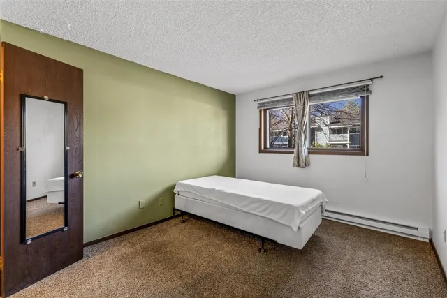 a room with a bed and a window