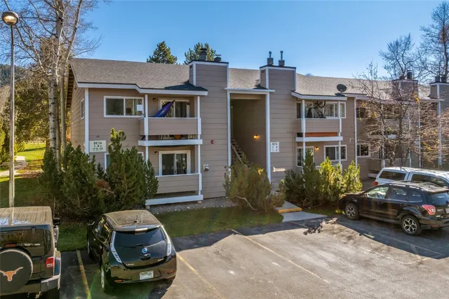 an aerial view of residential house and sandy dunes