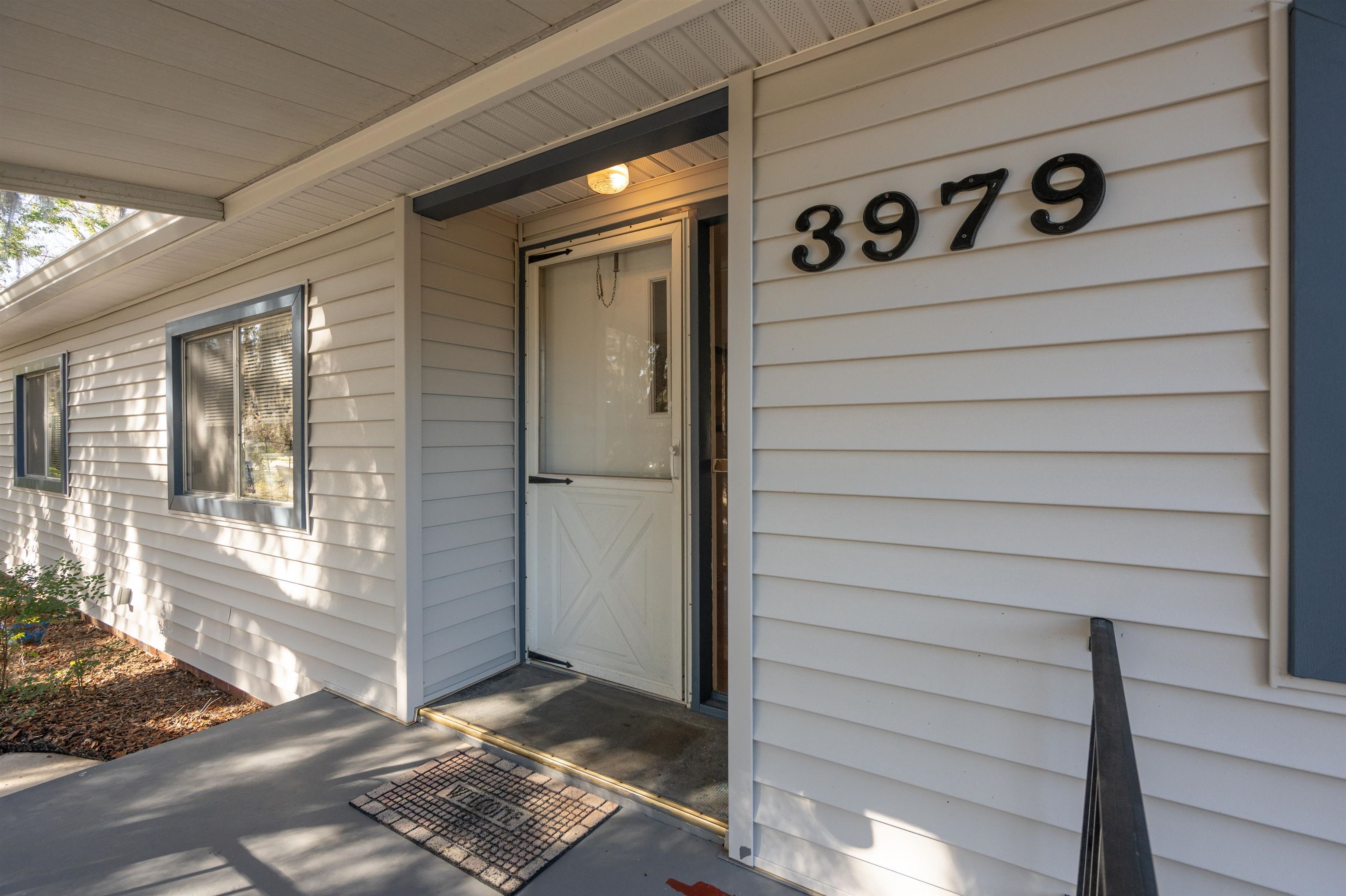 3979 Oak Terrace Road St. Augustine, FL 32086 - Photo 3 of 36 a view of a door and wooden deck
