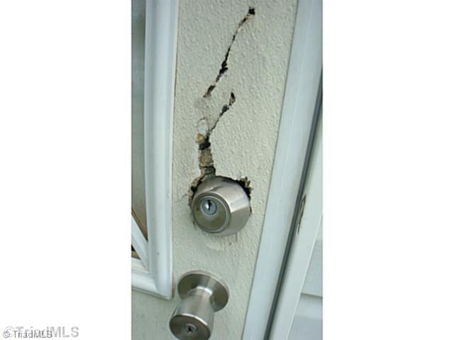 8901 Friendship Church Road Reidsville, NC 27320 - Photo 4 of 15 Exterior Back. back door damaged