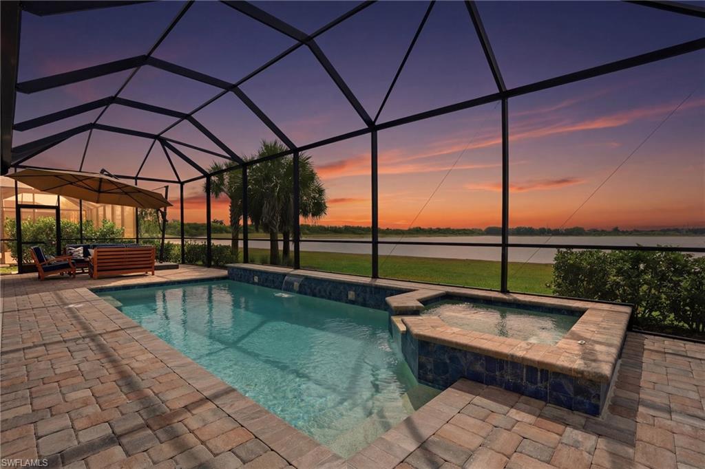 19696 Aqua View Lane Fort Myers, FL 33913 - Photo 42 of 50 a swimming pool with outdoor seating