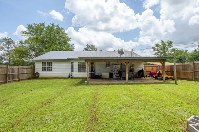 a view of a house with garden and porch
