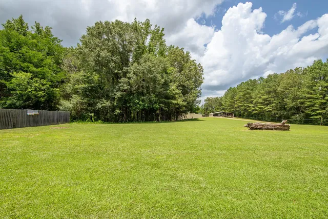 a view of a yard with an outdoor space
