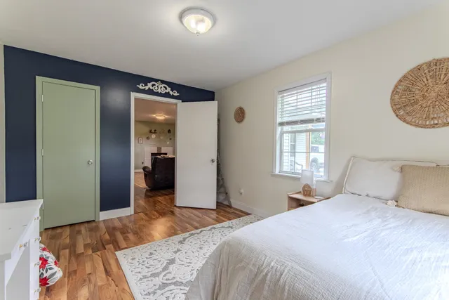 a view of a workspace with furniture and wooden floor