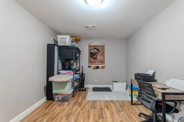 a room with furniture and wooden floor