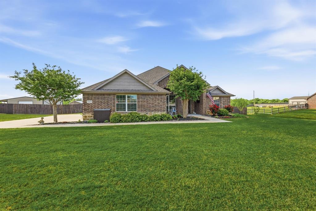113 Heather Lane Decatur, TX 76234 - Photo 2 of 32 a front view of a house with a yard