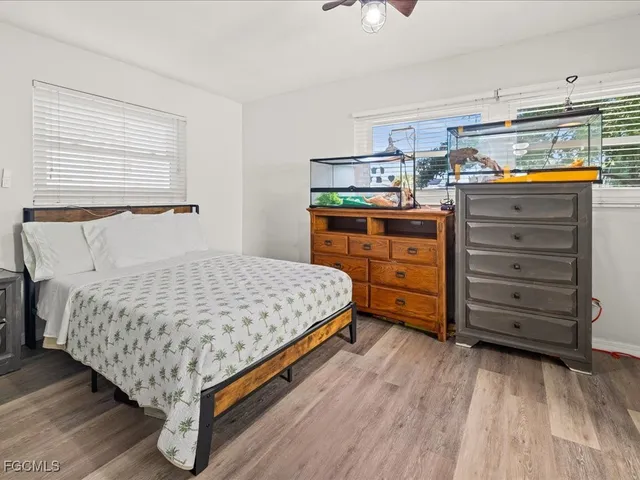 a bed room with a bed and a dresser